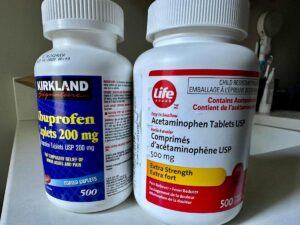 A bottle of Ibuporophin on he left and a bottle of Acetaminophen on the right